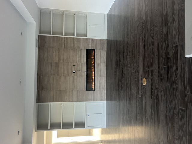 Naples Linear Fireplace & Built-In Feature Wall — Custom Fireplace & Built-Ins in Naples