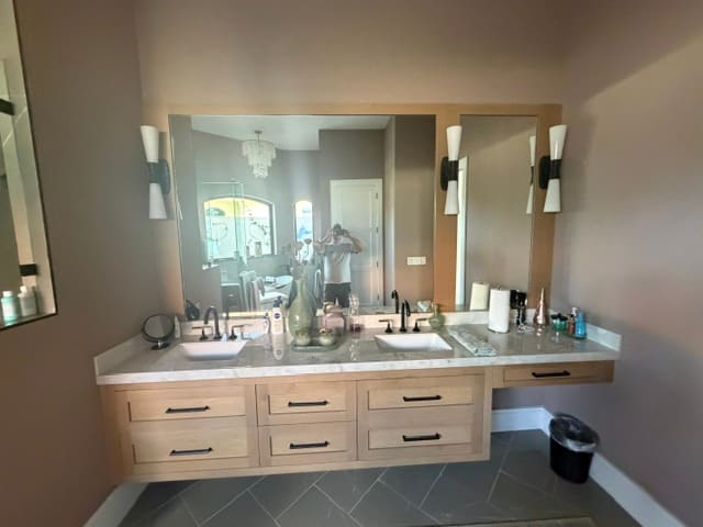 Double vanity master bathroom remodel with custom oak cabinetry