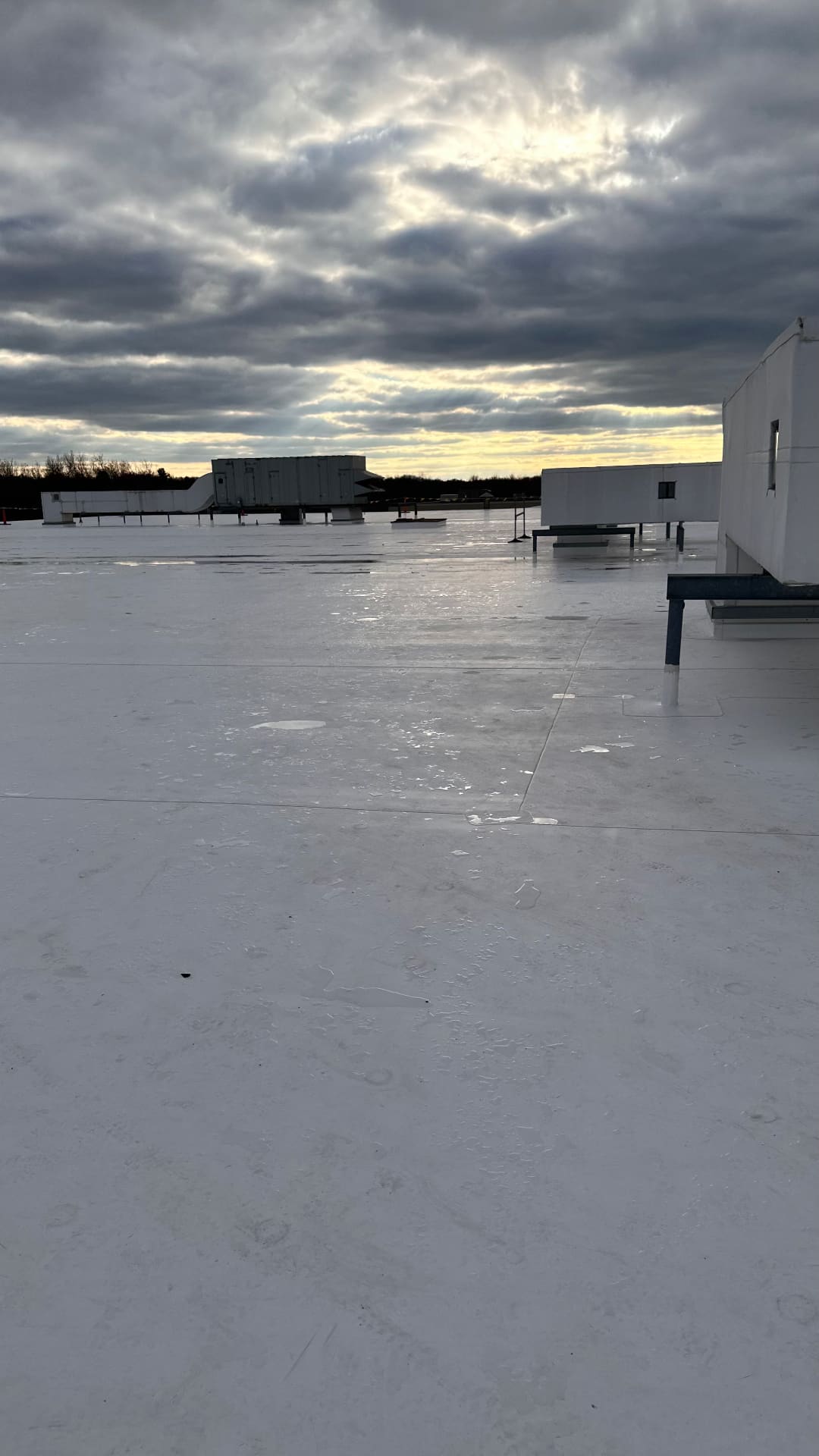 Completed white commercial flat roof in Southwest Florida at sunset