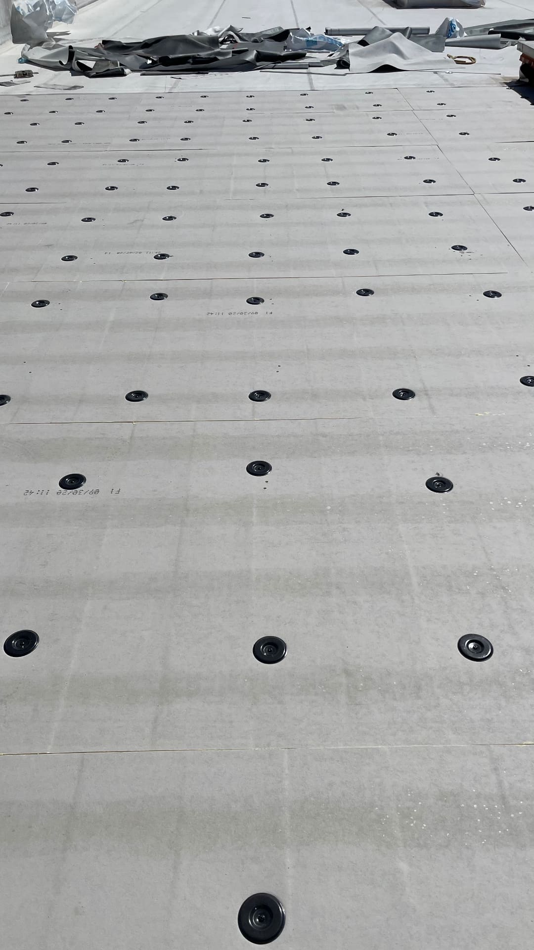 TPO roof insulation with fastener and plate pattern ready for membrane