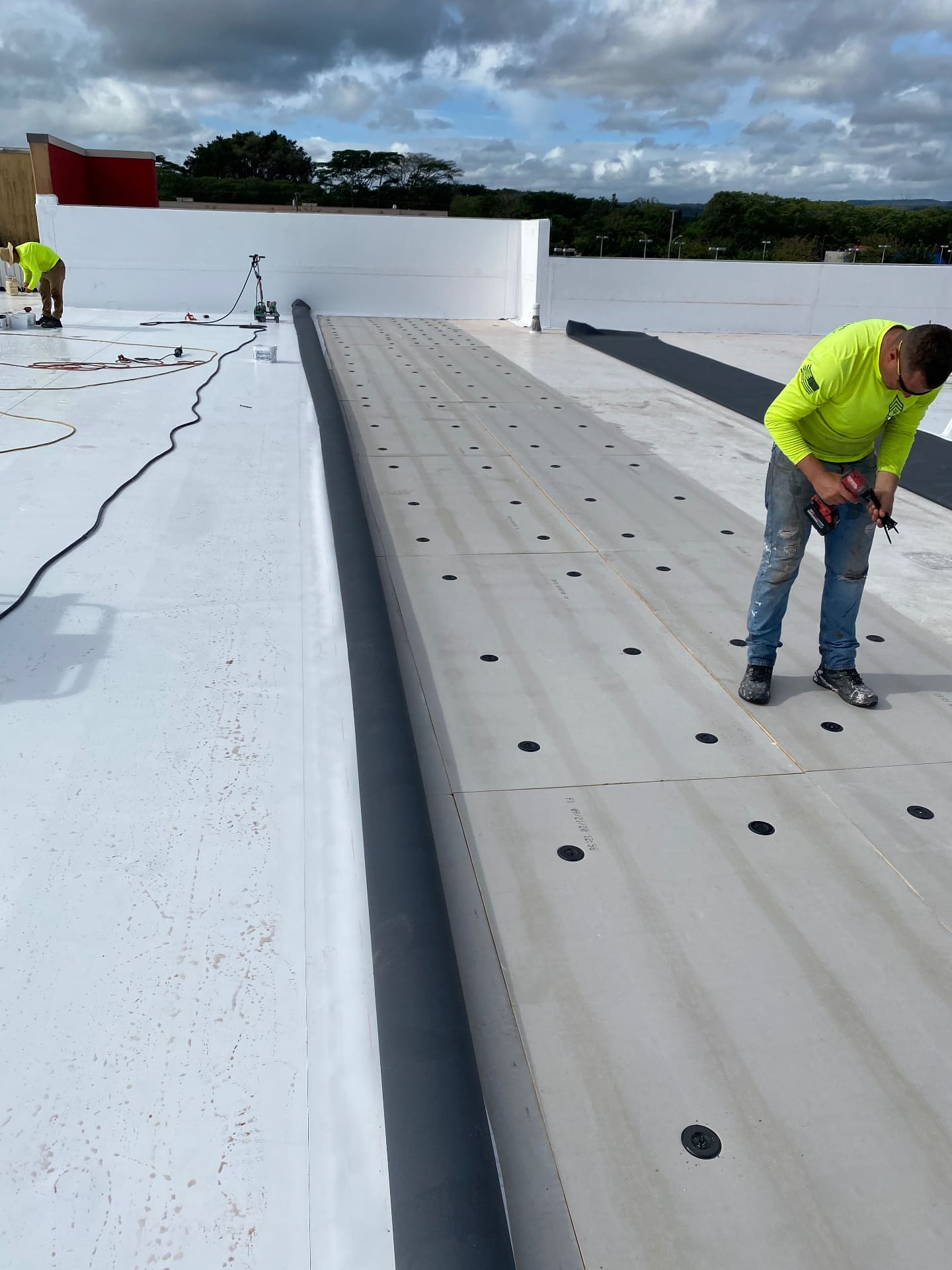 Titan Builder crew installing a commercial TPO roofing system