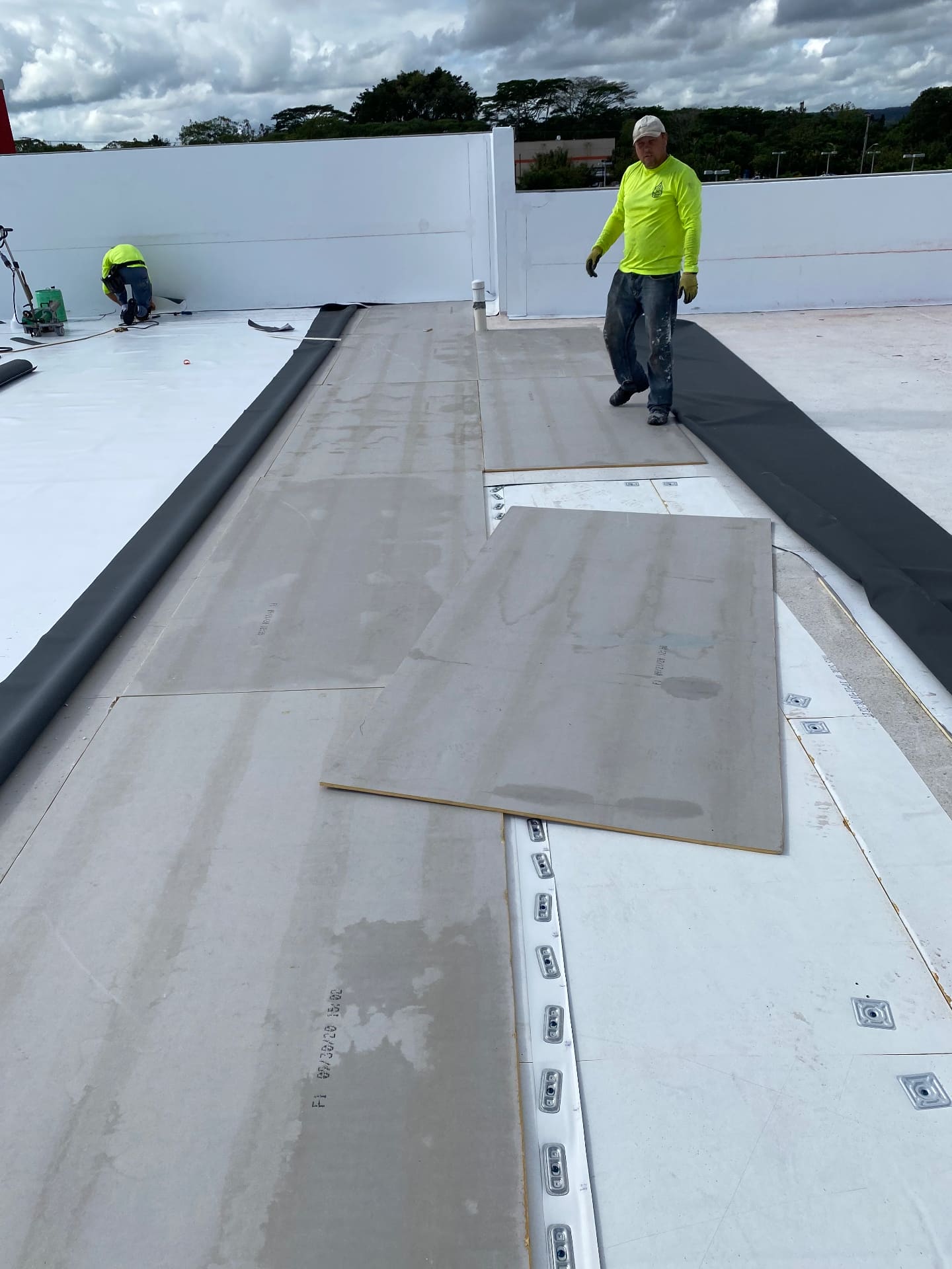 Commercial flat roof installation in progress with Titan Builder roofing crew