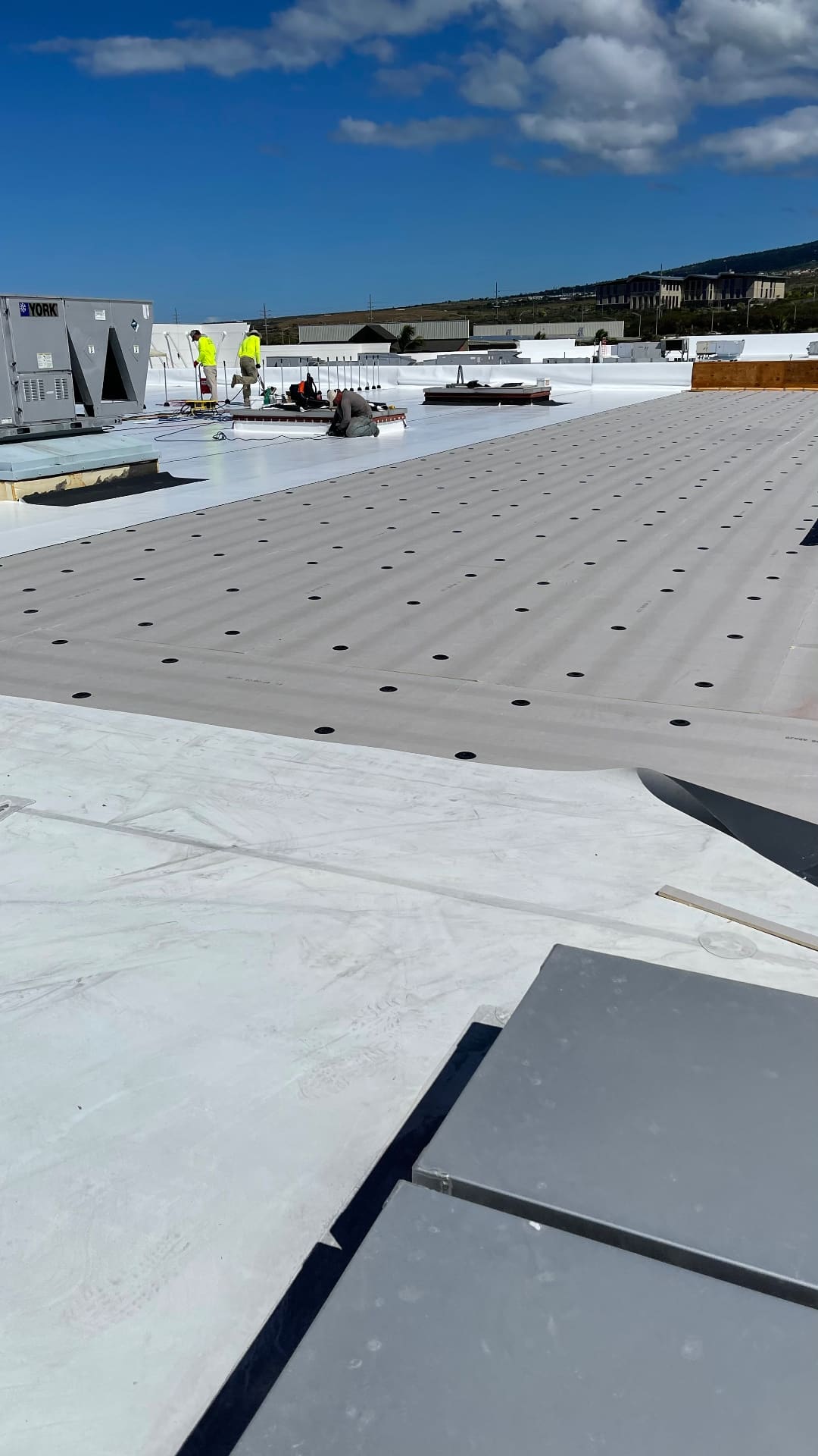 TPO roof insulation board fastened in place before membrane installation